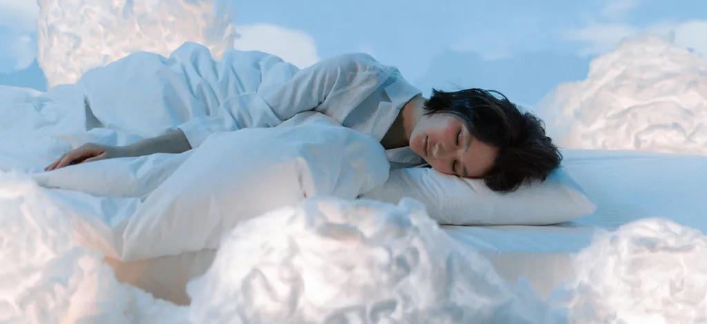 Fueling recovery: A person sleeping on clouds. Describing the value of sleeep in early recovery